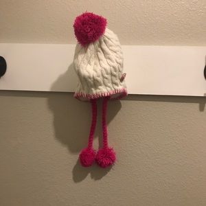 White glitter beanie with pink Pom Pom.